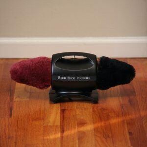 A black and red fuzzy object on a black base labeled 'Tick Box Player'.